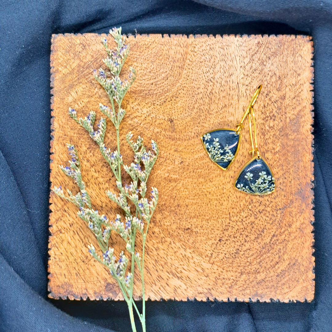 Small Curved Triangle Dangle Earring - Real White Pressed Flowers in Black Resin Set in Gold-Plated Stainless Steel