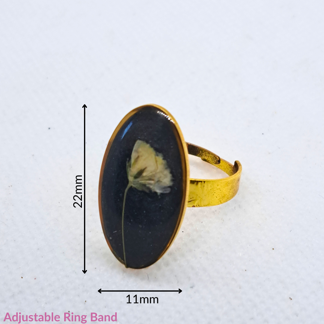 Medium Oval Ring - Real White Pressed Flowers in Black Resin Set in Gold-Plated Stainless Steel