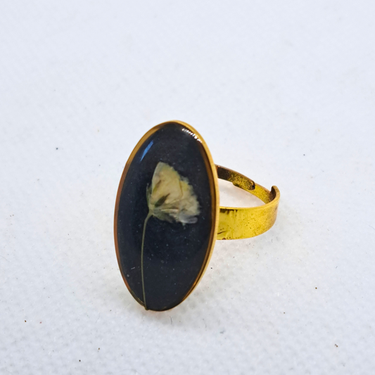 Medium Oval Ring - Real White Pressed Flowers in Black Resin Set in Gold-Plated Stainless Steel