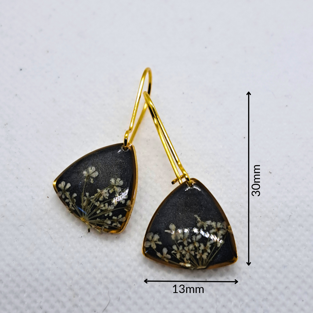 Small Curved Triangle Dangle Earring - Real White Pressed Flowers in Black Resin Set in Gold-Plated Stainless Steel